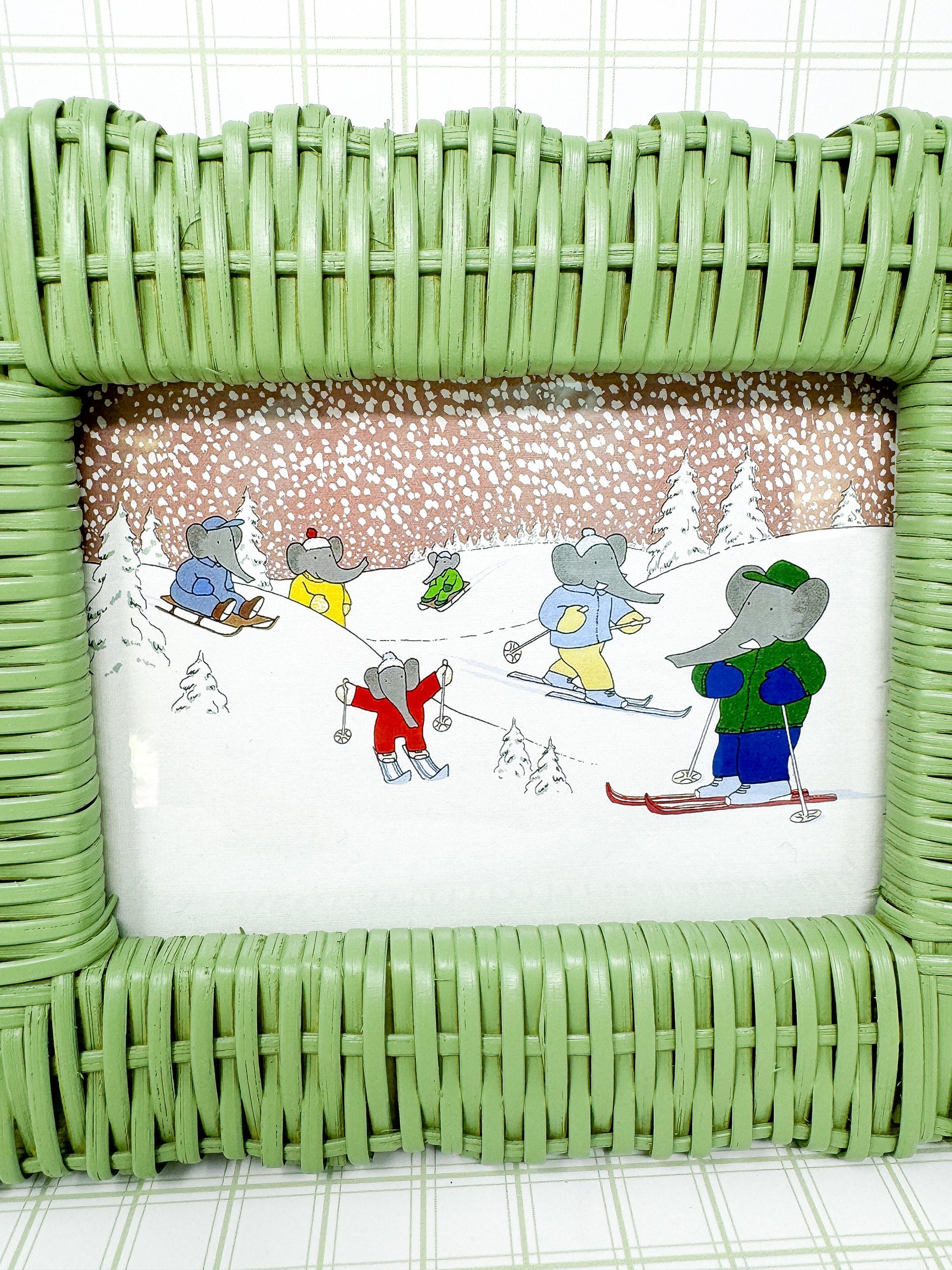 Vintage Babar the Elephant Skiing Print in Green Wicker Frame