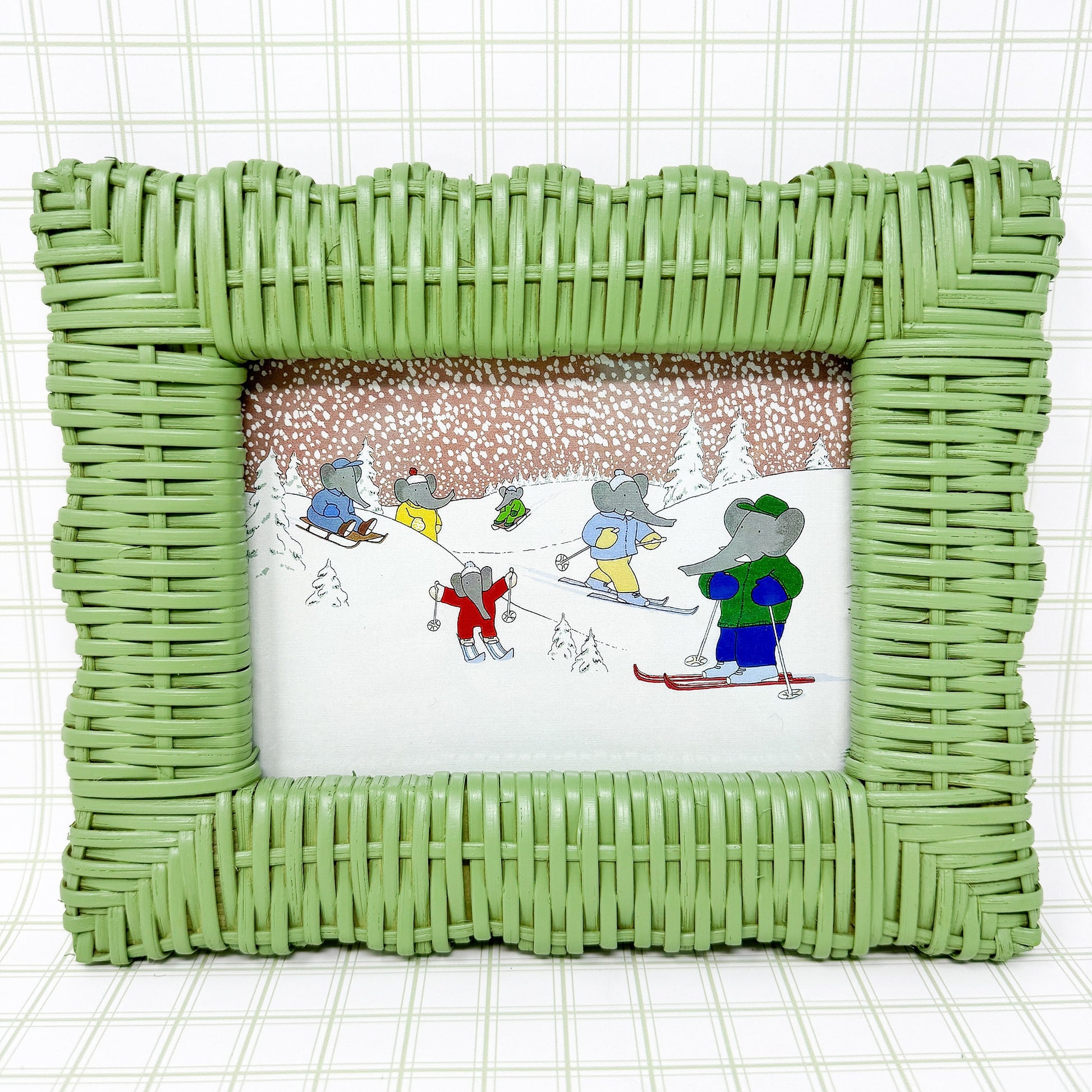 Vintage Babar the Elephant Skiing Print in Green Wicker Frame