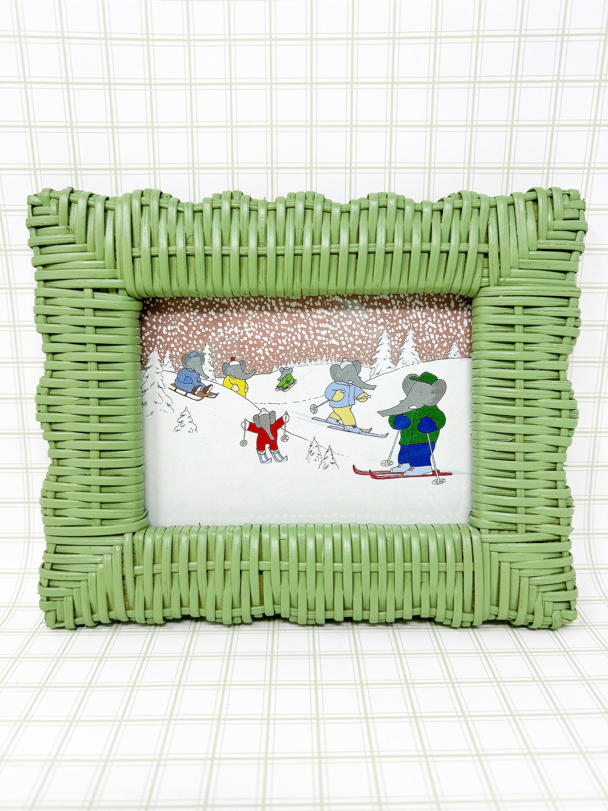 Vintage Babar the Elephant Skiing Print in Green Wicker Frame